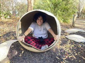 Demmi Ramos sitting inside a spherical container