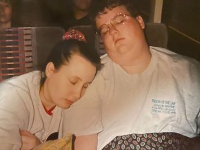 Natisha and Tyler Prince snooze on the A Cappella Choir tour bus