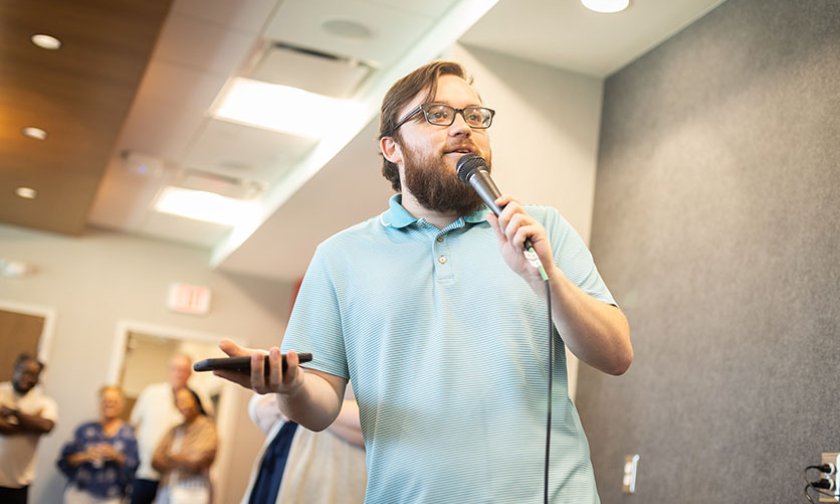Zach Lindler addresses fellow students in Belk Centrum during First Week
