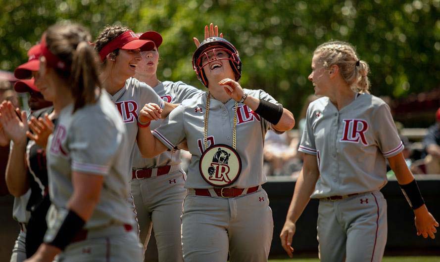 Softball teammates celebrate win on the field