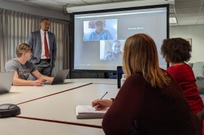 M.Div students and professor in class with students attending virtually over Zoom