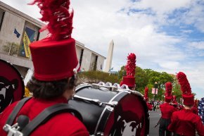 Marching band along the Mall with Washington Monument in background