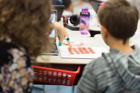 Teacher candidates working with students in literacy lab