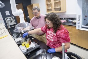 Christina Fisher conducts an experiment in a lab