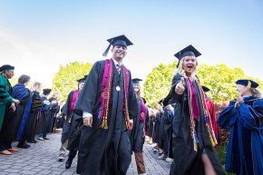 Class officers Diego Sanjuan and Bethany Perry lead the line of 2024 graduates