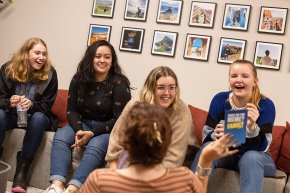 Melanie Mora participates in a game night with five international students