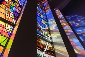 Closeup low angle of the stained glass panels in the LTSS chapel with the dove visible