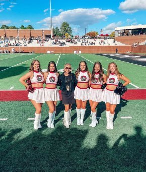 Members of the Spirit Team post with Coach Grace Marley