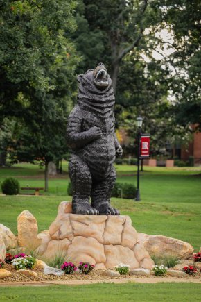 A standing bear statue situated outside