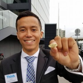 Thinh Truong shows his Fulbright scholar badge