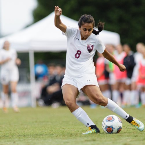 Aqsa Mushtaq plays soccer outside