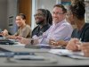 Seminary students in a classroom talking amongst themselves