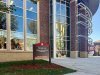 New campus building sign in front of George Hall