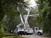 Utility crew cleaning up and repair electric lines near Hickory campus